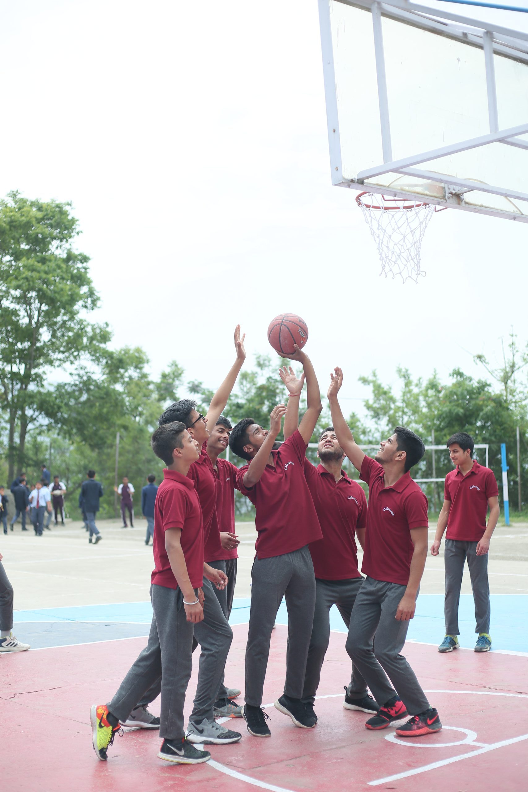 Students playing basketball
