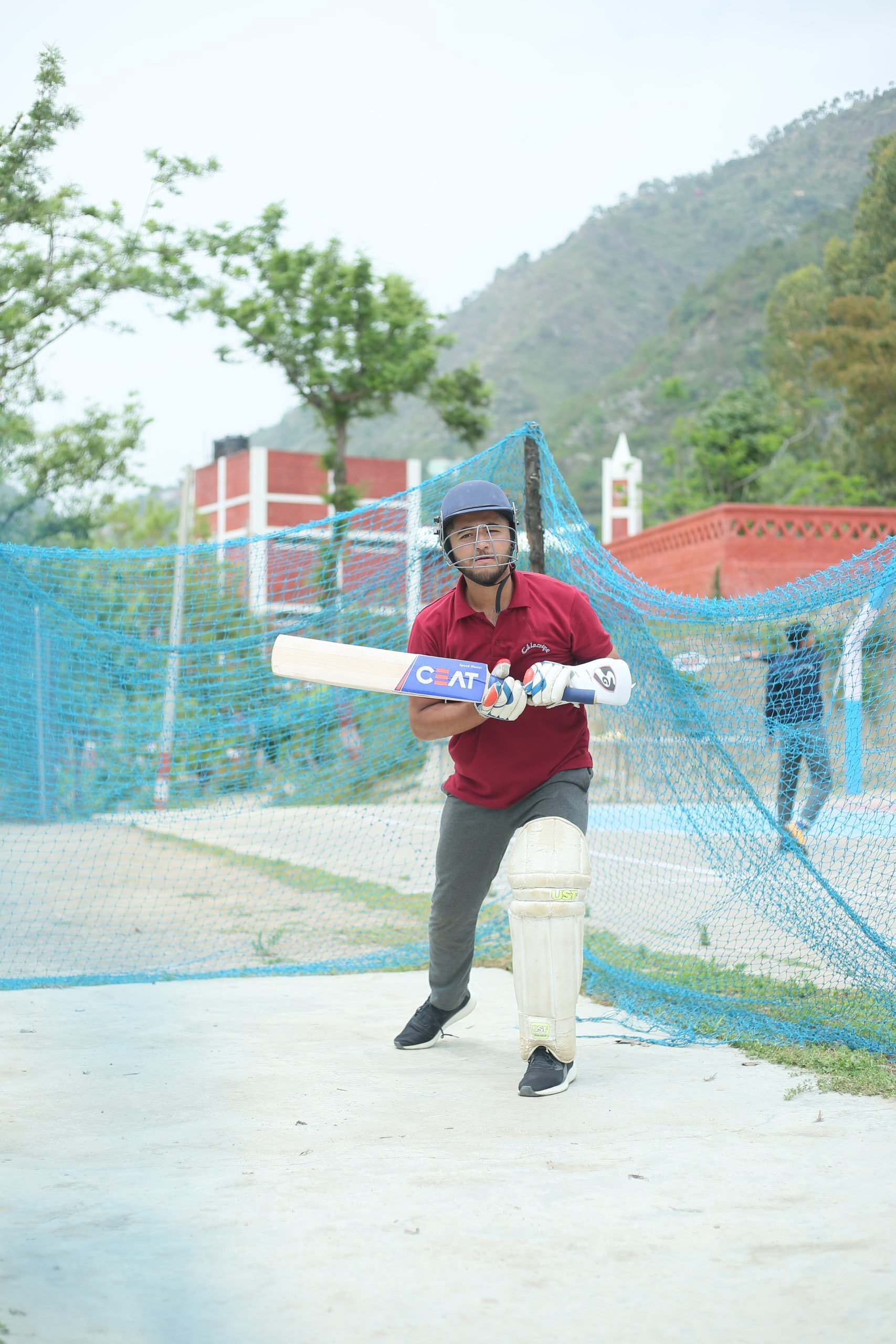 Students playing cricket